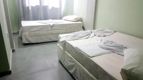 Postel nebo postele na pokoji v ubytování Hotel Mamma Mia