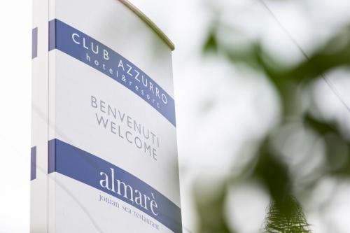 a sign for the university of almingham at Club Azzurro Hotel & Resort in Porto Cesareo