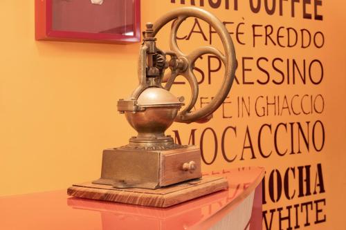 an old metal object on top of a table at Club Azzurro Hotel & Resort in Porto Cesareo