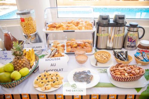 a table with different types of food on it at VILLA DE L'INTEGRATION in Ouagadougou