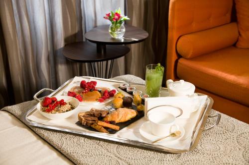a tray of food on a table in a hotel room at Palazzo Navona Hotel in Rome