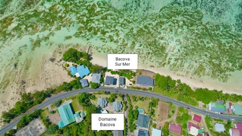 an aerial view of a road next to a beach at Le Domaine de Bacova in Pointe Au Sel 
