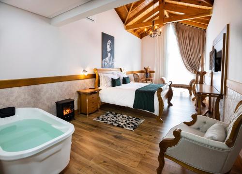 Кровать или кровати в номере Cerro Azul Hotel Fazenda