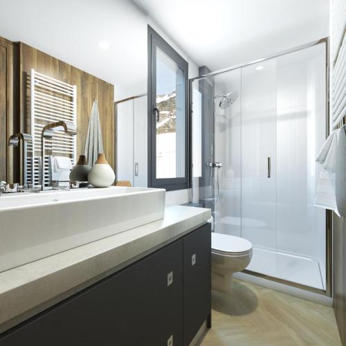 a bathroom with a sink and a toilet and a shower at Chalets & Glamping Nassfeld by ALPS RESORTS in Kötschach