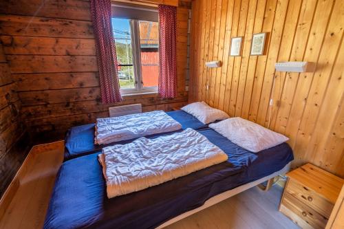 Postel nebo postele na pokoji v ubytování Å-Hamna Rorbuer