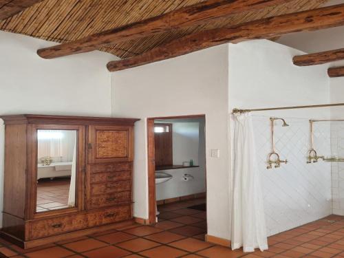 a bathroom with a tub and a shower stall at Red Mountain Ridge Karoo Oasis and Guest Farm in Buffelskloof
