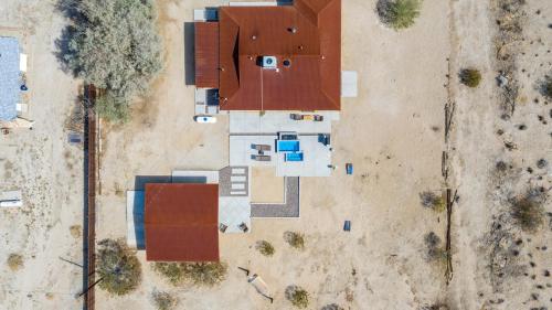 an overhead view of a building with red roofs at @ Marbella Lane - The Moon Designer Home right behind the JTNP in Joshua Tree