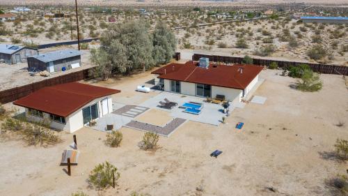 an aerial view of a house in the desert at @ Marbella Lane - The Moon Designer Home right behind the JTNP in Joshua Tree