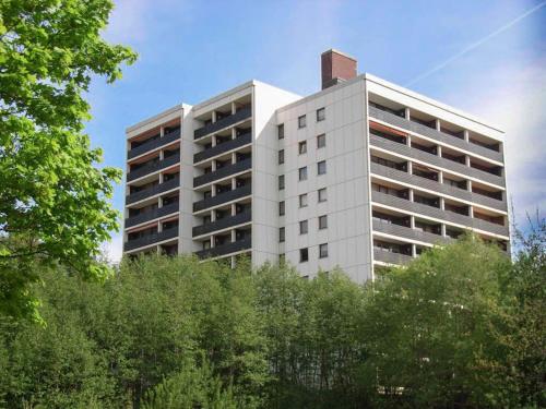 a tall white building with a chimney on top of it at Ferienapartment Hoch hinaus in Kniebis