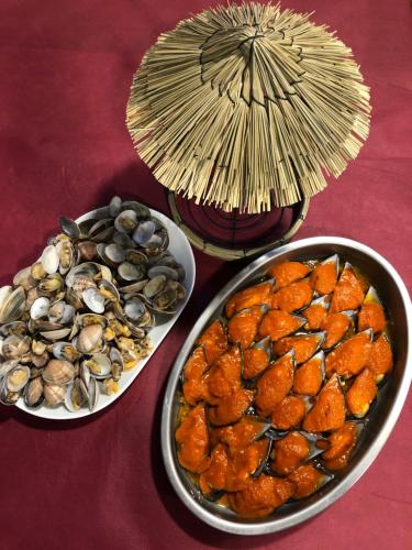 three bowls of seafood and mussels on a table at Villa Palatina in Bolgues