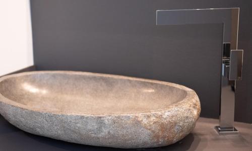 a large stone bath tub in a bathroom at Ex-L in Fiume Veneto
