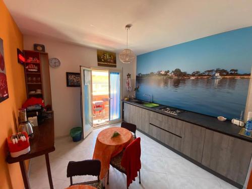 a living room with a large tv on the wall at Colomba Bianca in Marsala