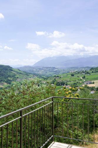 a balcony with a view of a valley at Mama Maja in Vacri