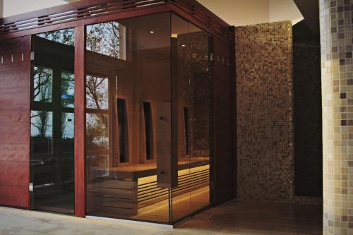 an entrance to a building with a glass door at Hotel Marina Port in Balatonkenese