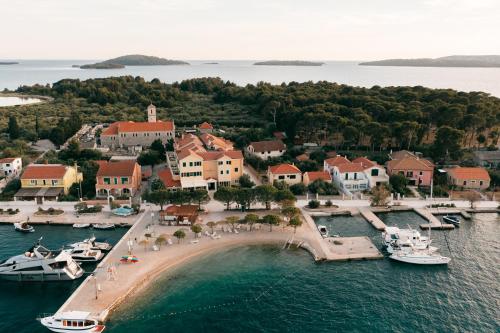 an aerial view of a island with boats in the water at Hotel Spongiola in Krapanj