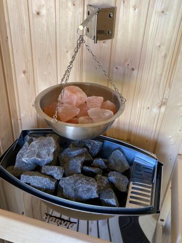 a bowl on top of a tray of rocks at Villa Detelina in Sapareva Banya