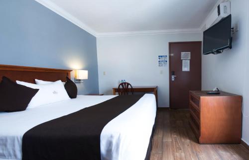 Postel nebo postele na pokoji v ubytování Del Marques Hotel and Suites