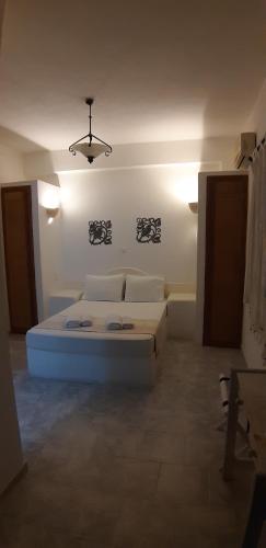 a bedroom with a bed in a room at Villa Spyros Santorini in Perissa