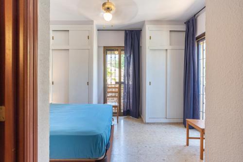 Llit o llits en una habitació de Oasis Playamar