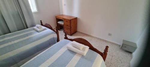 Ένα ή περισσότερα κρεβάτια σε δωμάτιο στο Latchi Area Apartments