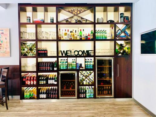 a store with a large display of bottles of alcohol at City Hotel in Eisenach
