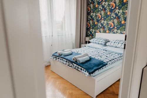 Säng eller sängar i ett rum på Jeleni Zakątek - apartament w stolicy Karkonoszy