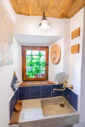 a bathroom with a sink and a window at Fiesole's cozy Apartment 2 in Fiesole