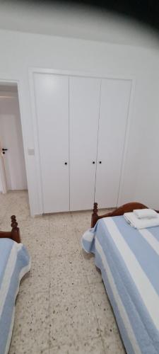 Ένα ή περισσότερα κρεβάτια σε δωμάτιο στο Latchi Area Apartments