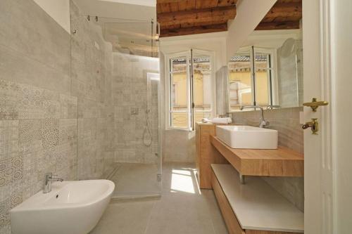 a bathroom with a sink and two sinks in it at DIMORE DEL CENTRO - Domus Aurea in Salò
