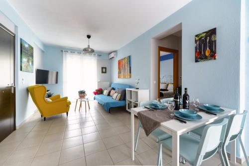 a kitchen and living room with a table and chairs at Amazing Place in Pedini in Ioannina