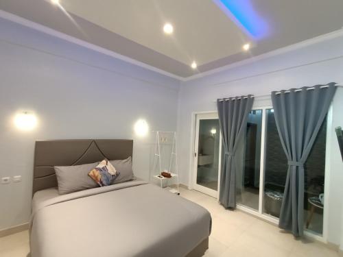 Ένα ή περισσότερα κρεβάτια σε δωμάτιο στο Bis homestay