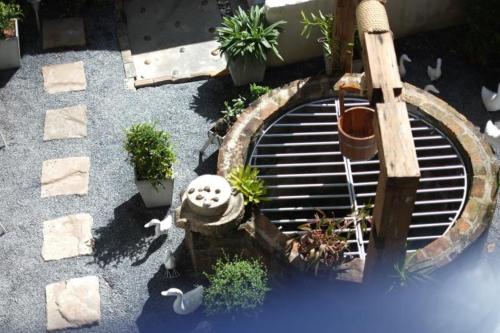 an overhead view of a garden with a grate at Chanchalay Hip Hostel SHA Extra Plus in Krabi town