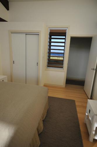 Ένα ή περισσότερα κρεβάτια σε δωμάτιο στο Turnstone Beach House