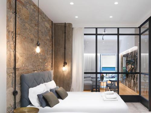 A bed or beds in a room at 5 star lux suite in Kolonaki.
