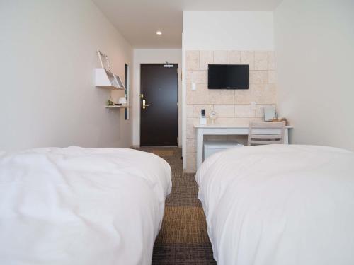 Кровать или кровати в номере Kyo-Anthu Inn