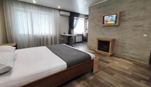 Кровать или кровати в номере Люкс в центре Металлургов 31 KR Apartments