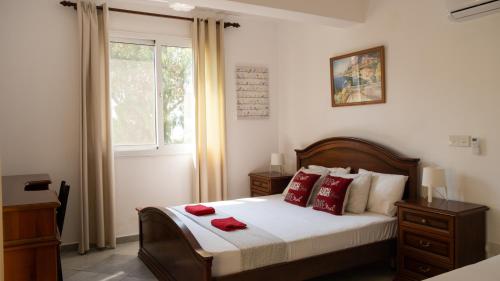 מיטה או מיטות בחדר ב-Villa Kiveli