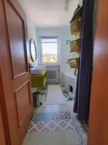 a bathroom with a sink and a tub at Forest Lodge in Bayerisch Eisenstein