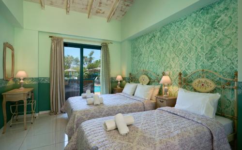Ένα ή περισσότερα κρεβάτια σε δωμάτιο στο Villaggio Maistro