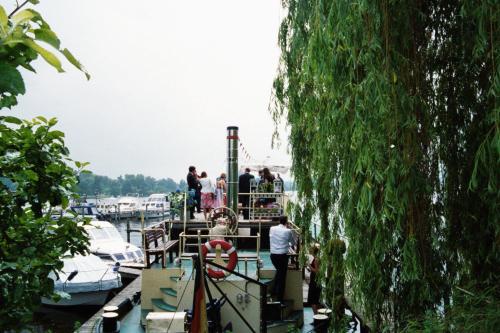 a group of people on a boat in the water at Pension am Tiefen See in Potsdam