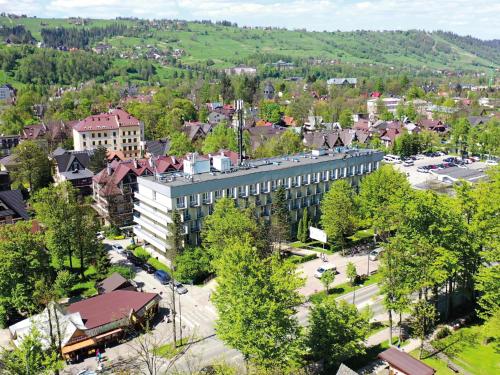 an aerial view of a town with a building at Kolejarz Natura Tour in Zakopane