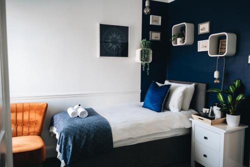 Ένα ή περισσότερα κρεβάτια σε δωμάτιο στο Cloves Boutique Bed & Breakfast