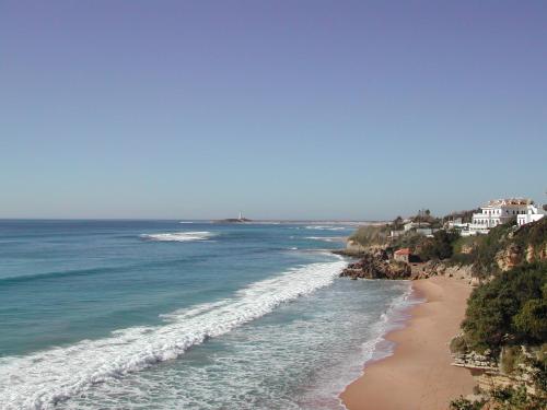 a view of a beach with houses and the ocean at Fortuna in Los Caños de Meca