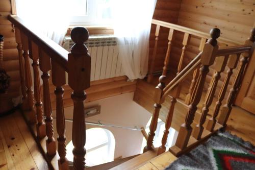 a stairs with a toilet in the floor in a room at Садыба Полыцька in Guta