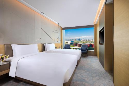 Ένα ή περισσότερα κρεβάτια σε δωμάτιο στο InterContinental Taiyuan by IHG