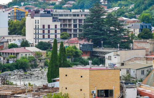 a view of a city with buildings and trees at Valkhida's Apartment in Kutaisi