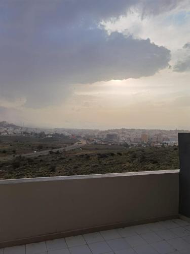 a balcony with a view of a city at فندق الحاتمية in Abha