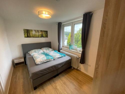 En eller flere senge i et værelse på Fewo Am Park