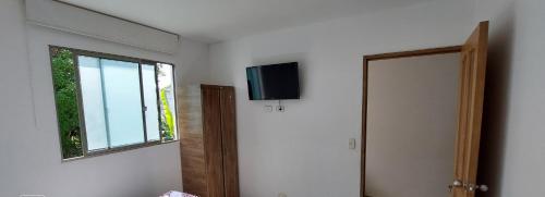 TV i/ili multimedijalni sistem u objektu Apartamento la Isla 1-Coveñas