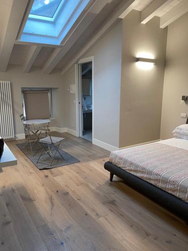 a bedroom with a bed and a skylight at La Casa di Paola in Lovere